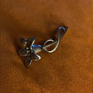 Silver Treble Clef Brooch with Floral Embellishment